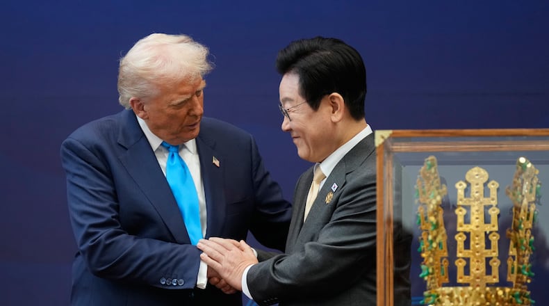 President Donald Trump shakes hands with South Korean President Lee Jae Myung as they attend a high honor ceremony at the Gyeongju National Museum in Gyoeongju, South Korea, Wednesday, Oct. 29, 2025. (AP Photo/Mark Schiefelbein)
