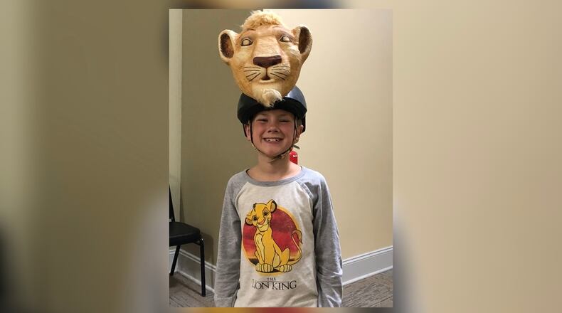 Colin Carn, who portrays Young Simba, displays the mask he’ll wear during the Springfield Arts Council’s Youth Arts Ambassadors’ production of “Disney’s The Lion King., Jr.” Photo by Brett Turner