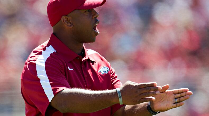 FAYETTEVILLE, AR - APRIL 21:   Interim Head Coach Taver Johnson of the Arkansas Razorbacks talks to his players on the field during the Spring Game at Donald W. Reynolds Stadium on April 21, 2012 in Fayetteville, Arkansas.  (Photo by Wesley Hitt/Getty Images)