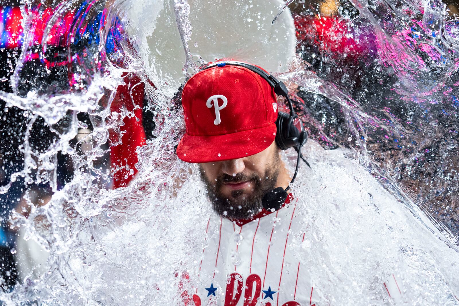Philadelphia Phillies' Kyle Schwarber, gets doused with water as he is giving a post game interview following a baseball game against the New York Mets, Tuesday, Sep. 9, 2025, in Philadelphia. (AP Photo/Chris Szagola)