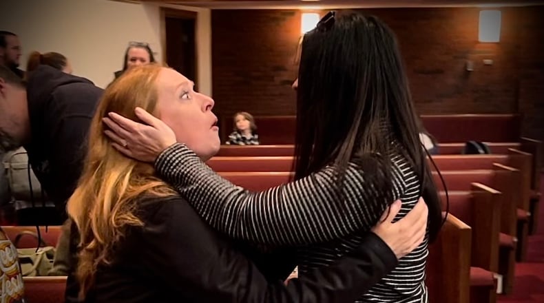In January, Jennifer Tuttle (right) told friend Julie Nourse she was her anonymous kidney donor at church. "I am the one," Tuttle told Nourse, whose husband captured the emotional moment. Tuttle gave Nourse her kidney on April 1, 2024. CONTRIBUTED