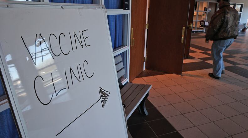 A man walks into a Champaign County COVID-19 clinic at the government center in Urbana last week. BILL LACKEY/STAFF