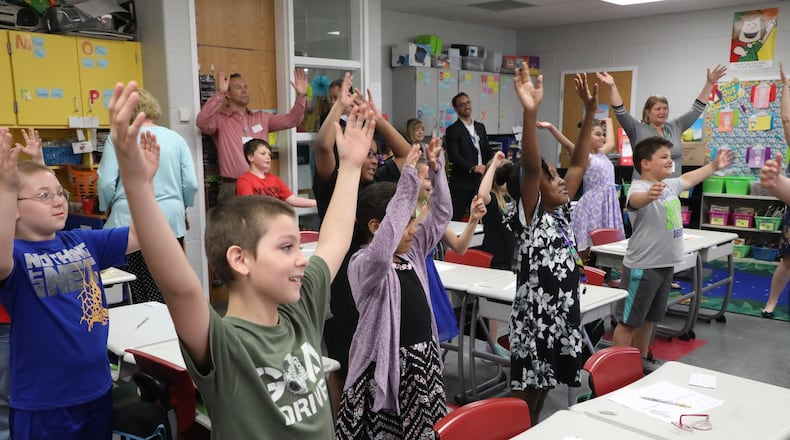 Third grade students at Simon Kenton Elementary participate in the Go Noodle program sponsored by Mercy Health. The program combines educational material with physical activities. BILL LACKEY/STAFF