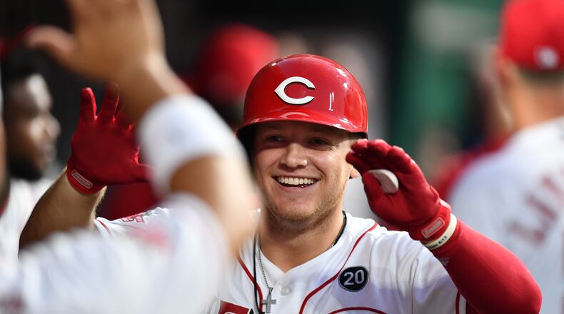 CINCINNATI, OH - JULY 20:  Josh VanMeter #17 of the Cincinnati Reds celebrates in the dugout after hitting a two-run home run in the seventh inning against the St. Louis Cardinals at Great American Ball Park on July 20, 2019 in Cincinnati, Ohio. Cincinnati defeated St. Louis 3-2.  (Photo by Jamie Sabau/Getty Images)