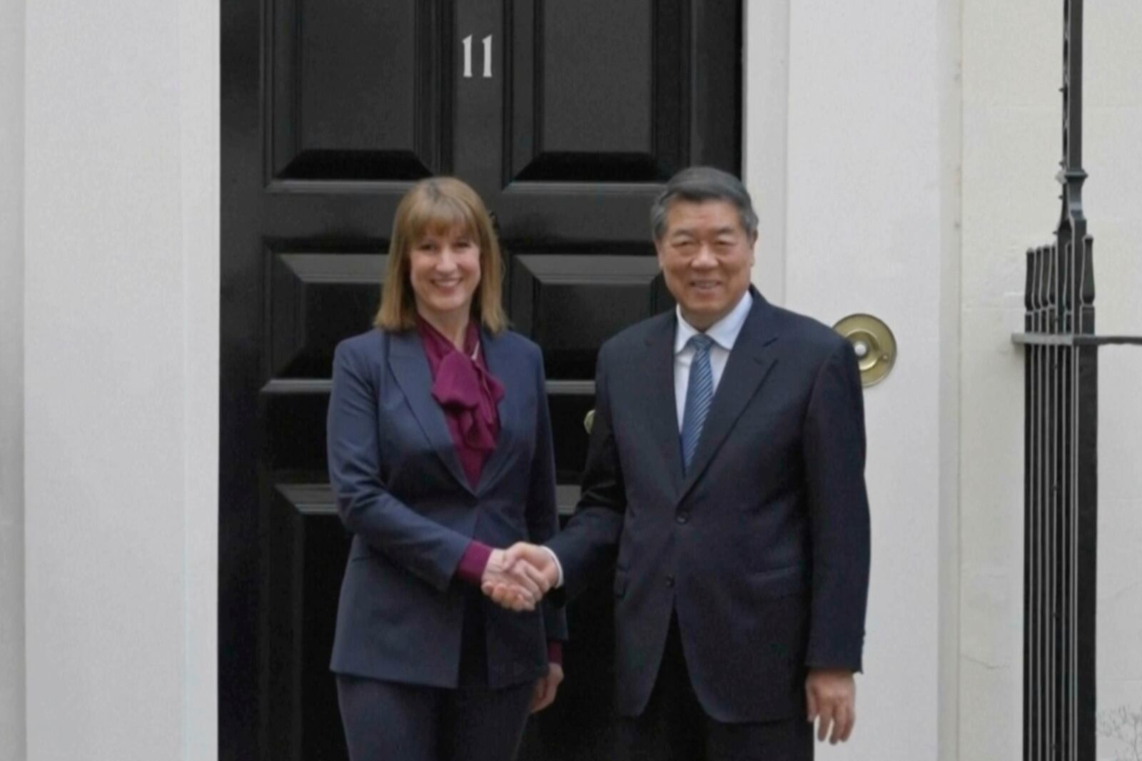 In this image, taken from a video footage run by Phoenix TV via AP Video, Chinese Vice Premier He Lifeng, right, poses for photos with British Chancellor of Exchequer, Rachel Reeves, outside 11 Downing Street in London, England, Sunday, June 8, 2025. (AP Photo/Phoenix TV via AP Video)