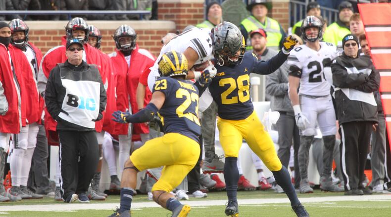 Ohio State’s Austin Mack catches a pass from Dwayne Haskins against Michigan on Saturday, Nov. 25, 2017, at Michigan Stadium in Ann Arbor. David Jablonski/Staff