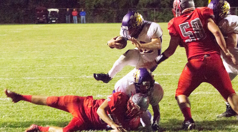 Mechanicsburg’s Joey Mascadri steps over two players and past Southeastern’s Connor Davis (58) for a one-yard touchdown run during the 2017 season at South Charleston. JEFF GILBERT / CONTRIBUTED