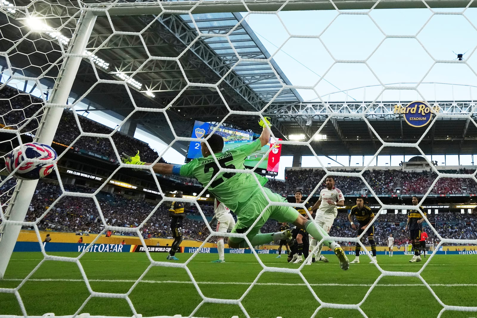 Boca Juniors' Agustin Marchesin (25) fails to stop Benfica's Nicolas Otamendi from scoring his side's second goal during the Club World Cup group C soccer match between Boca Juniors and Benfica in Miami Gardens, Fla., Monday, June 16, 2025. (AP Photo/Rebecca Blackwell)