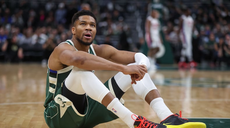 Milwaukee Bucks' Giannis Antetokounmpo reacts after suffering an injury during the first half an NBA basketball game against the Detroit Pistons, Wednesday, Dec. 3, 2025, in Milwaukee. (AP Photo/Kylie Bridenhagen)