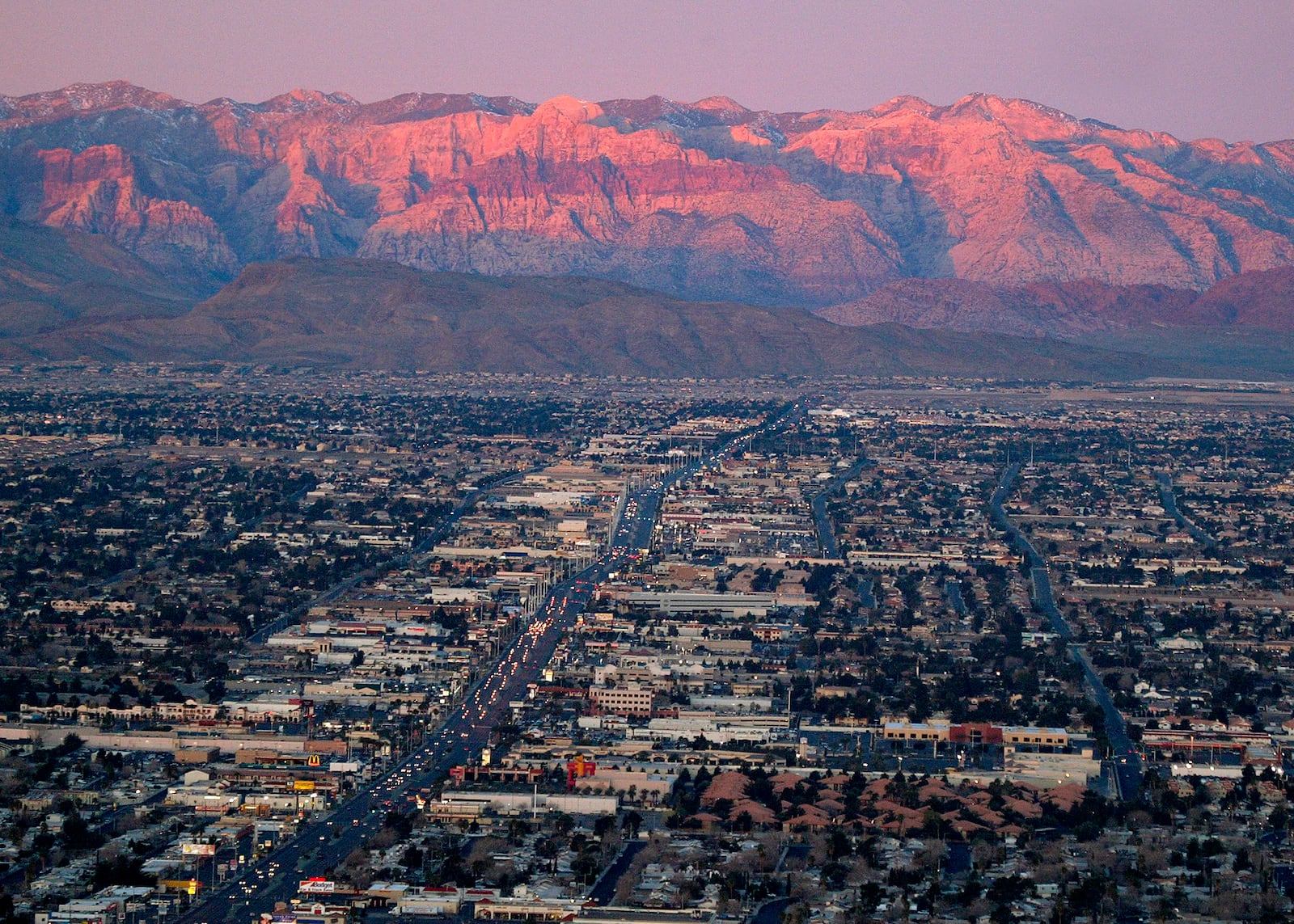 FILE - A view of the suburbs of Las Vegas from atop the Stratosphere tower looking west down Sahara Ave., towards the Spring Mountains, Feb. 9, 2005. (AP Photo/Joe Cavaretta, File)