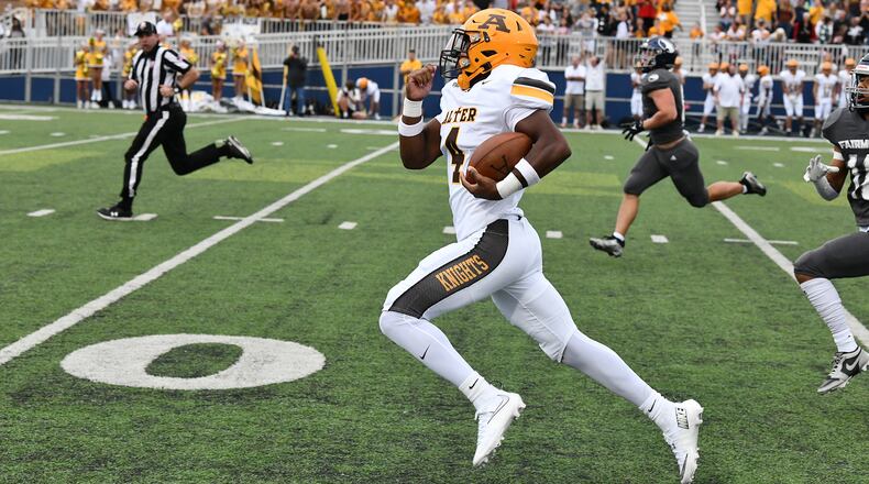 Alter quarterback Rod Owens breaks free on a 54-yard run to set up the game's first touchdown early in Thursday night's 28-21 win over Fairmont at Roush Stadium. JEFF GILBERT/CONTRIBUTED