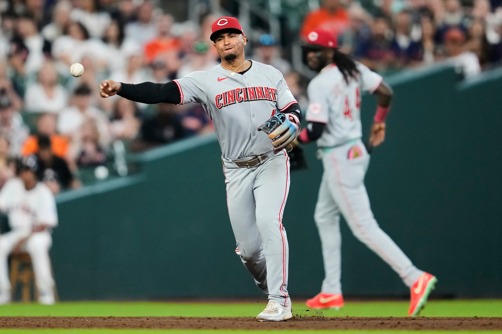Cincinnati Reds third baseman Santiago Espinal throws to first to out Houston Astros designated hitter Yainer Diaz during the third inning of a baseball game in Houston, Saturday, May 10, 2025. (AP Photo/Ashley Landis)