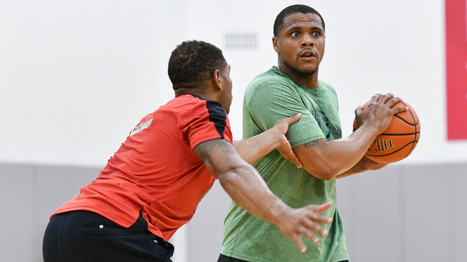 Former South standout Nate Miller looks to pass with pressure from Leon Rodgers during a practice with Ohio State alumni on Thursday at Value City Arena in Columbus. Miller, a former standout at South, is friends with Rodgers, who’s son JaJuan plays at Springfield. Contributed Photo by Bryant Billing