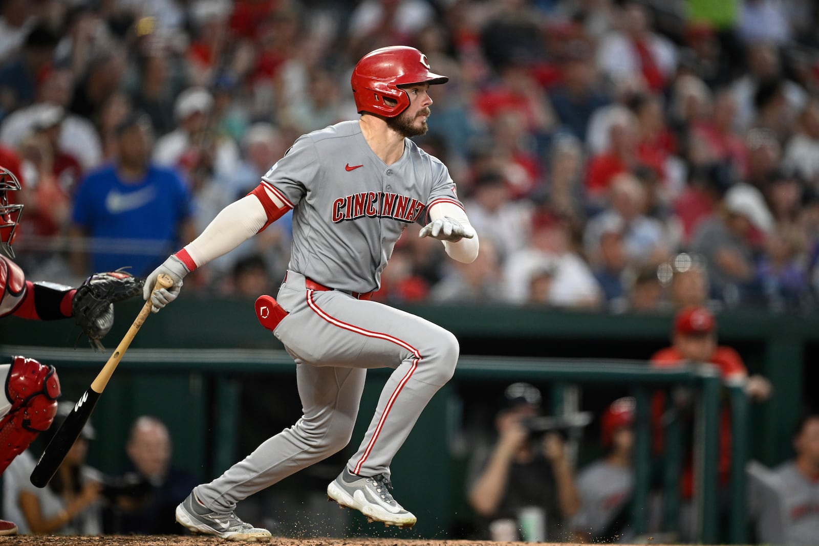 Cincinnati Reds' Gavin Lux follows through after hitting a single against Washington Nationals pitcher Luis García during the seventh inning of a baseball game in Washington, Tuesday, July 22, 2025. (AP Photo/Terrance Williams)