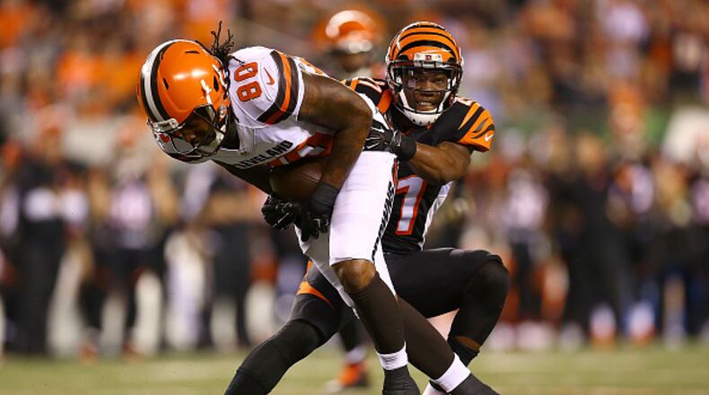 CINCINNATI, OH - NOVEMBER 5: Darqueze Dennard #21 of the Cincinnati Bengals tackles Dwayne Bowe #80 of the Cleveland Browns during the fourth quarter at Paul Brown Stadium on November 5, 2015 in Cincinnati, Ohio. Cincinnati defeated Cleveland 31-10.(Photo by Andrew Weber/Getty Images)