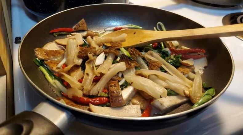 Jacob Bryant, who lives in Oxford in Butler County, and his partner, Ami Schulte, cooked dinner entirely from foraged foods, plus some chili peppers from a garden. The dish had ramps, garlic mustard, fiddleheads, and morel mushrooms. CONTRIBUTED/AMI SCHULTE