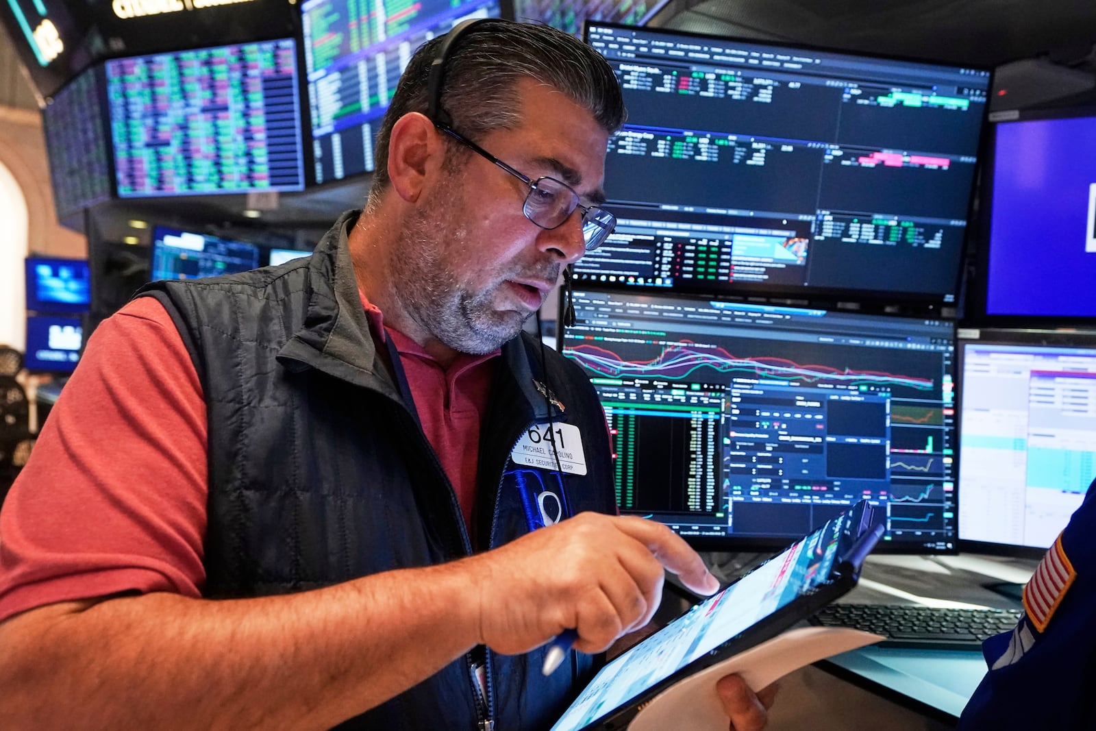 Trader Michael Capolino works on the floor of the New York Stock Exchange, Friday, June 27, 2025. (AP Photo/Richard Drew)
