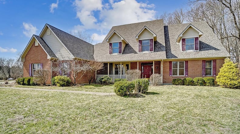 The 2-story home offers about 6,170 sq. ft. with a finished lower level and 7 bedrooms. The home is set on a 1.25-acre lot and includes a 4-car, side-entry garage. CONTRIBUTED PHOTO