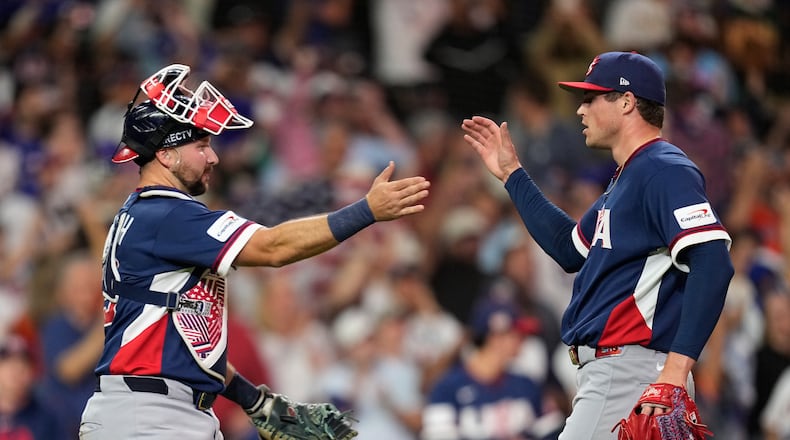 United States catcher Cal Raleigh, left, and pitcher Mason Miller, right, celebrate after their win over Canada in a World Baseball Classic quarterfinal game, Friday, March 13, 2026, in Houston. (AP Photo/David J. Phillip)