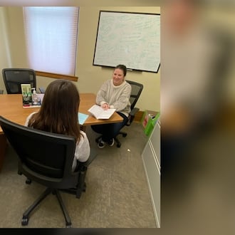 Clark County Department of Reentry Housing Specialist, McKenzie Burton, helps a community member review tenant rights. CONTRIBUTED