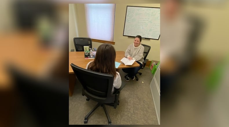 Clark County Department of Reentry Housing Specialist, McKenzie Burton, helps a community member review tenant rights. CONTRIBUTED