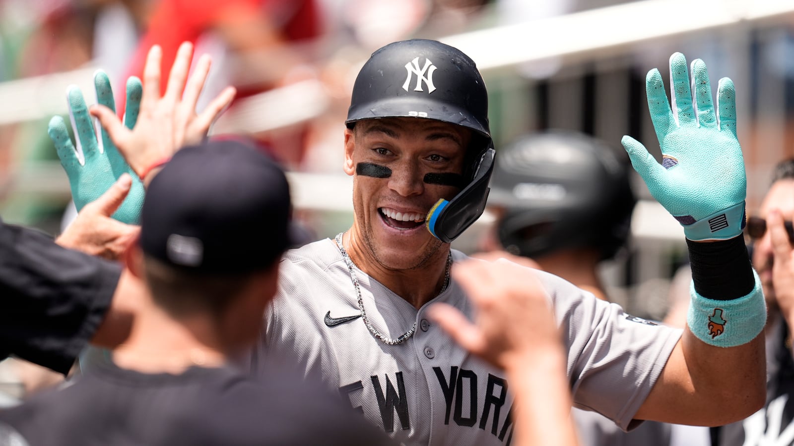 New York Yankees' Aaron Judge (99) celebrates his solo home run against the Atlanta Braves in the first inning of a baseball game, Sunday, July 20, 2025, in Atlanta. (AP Photo/Mike Stewart)