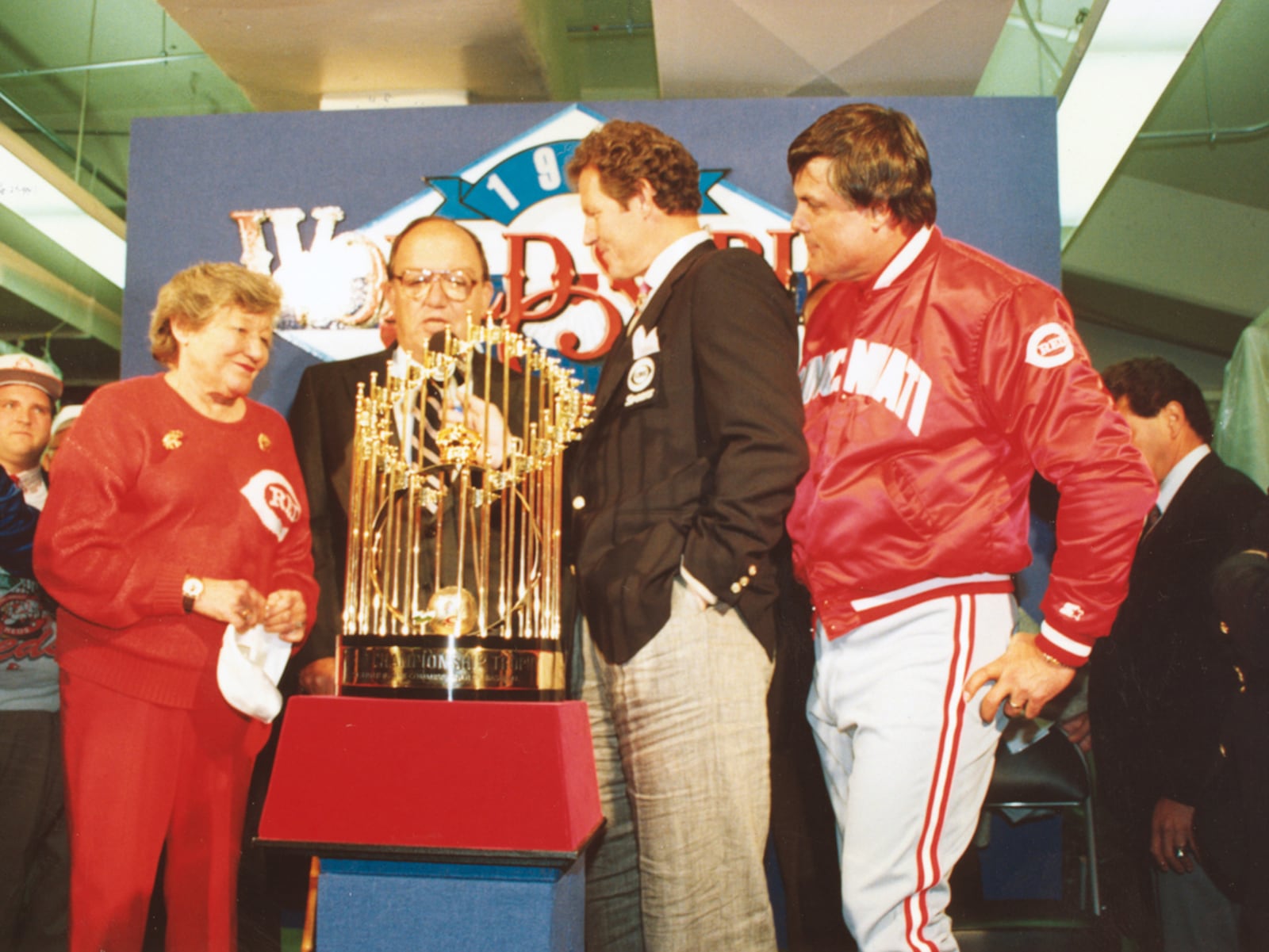 Cincinnati Reds owner Marge Schott (left) and manager Lou Piniella accept the World Series trophy after the Reds defeated the Oakland A's to win the 1990 World Series on Oct. 21, 1990 in Oakland, Calif.