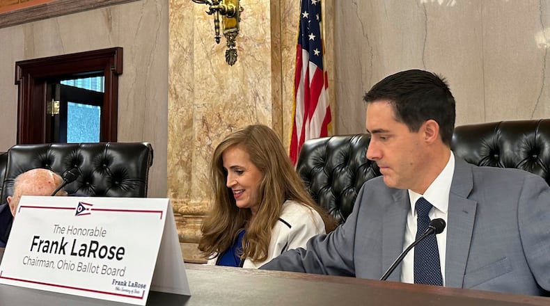 Ohio Secretary of State Frank LaRose, right, and state Sen. Theresa Gavarone prepare for a meeting of the Ohio Ballot Board at the Ohio Statehouse in Columbus, Ohio, Friday, Aug. 16, 2024. (AP Photo/Julie Carr Smyth)