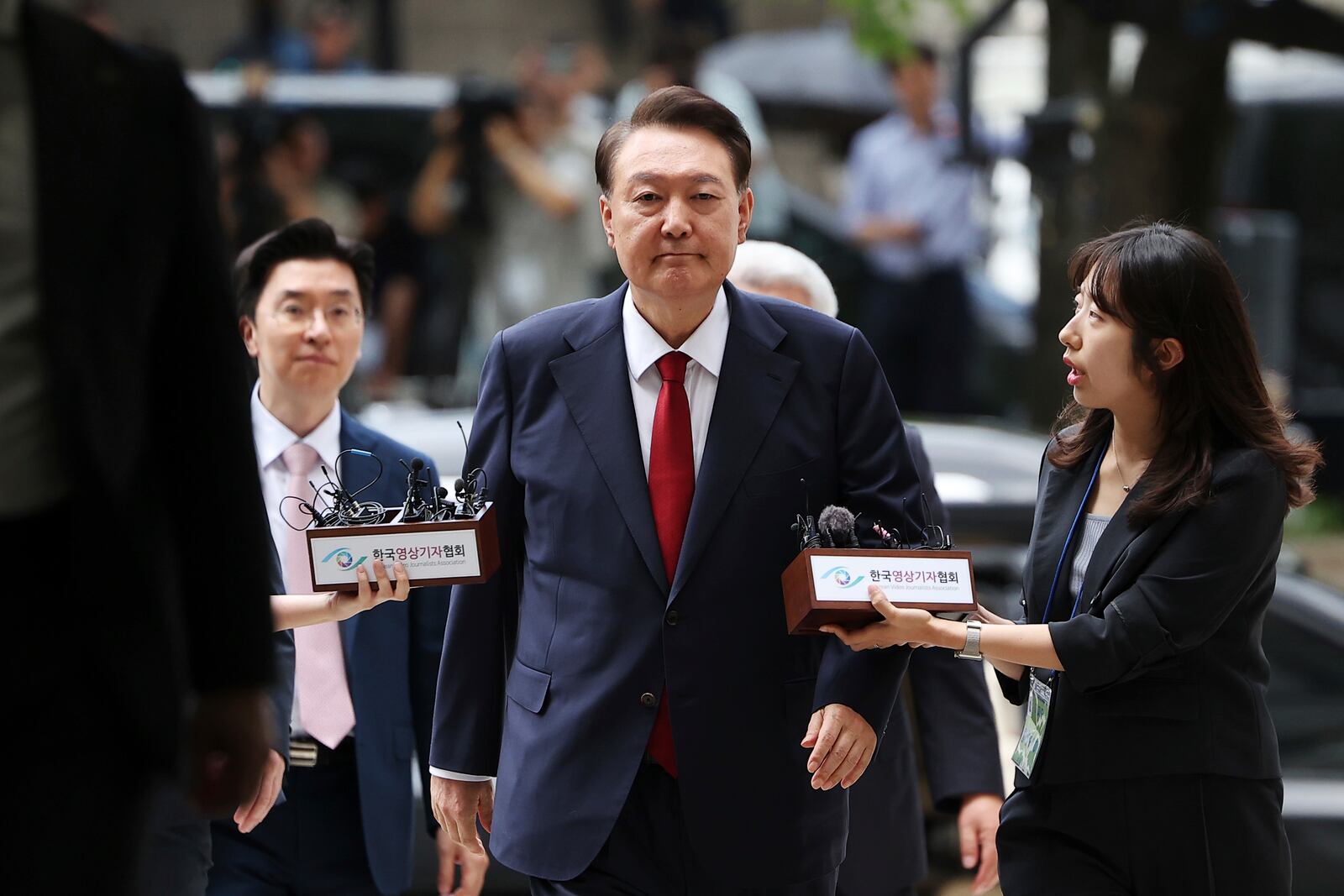 Former South Korean President Yoon Suk Yeol, centerm arrives at a court to attend a hearing to review his arrest warrant requested by special prosecutors in Seoul, South Korea Wednesday, July 9, 2025. (Kim Hong-Ji/Pool Photo via AP)