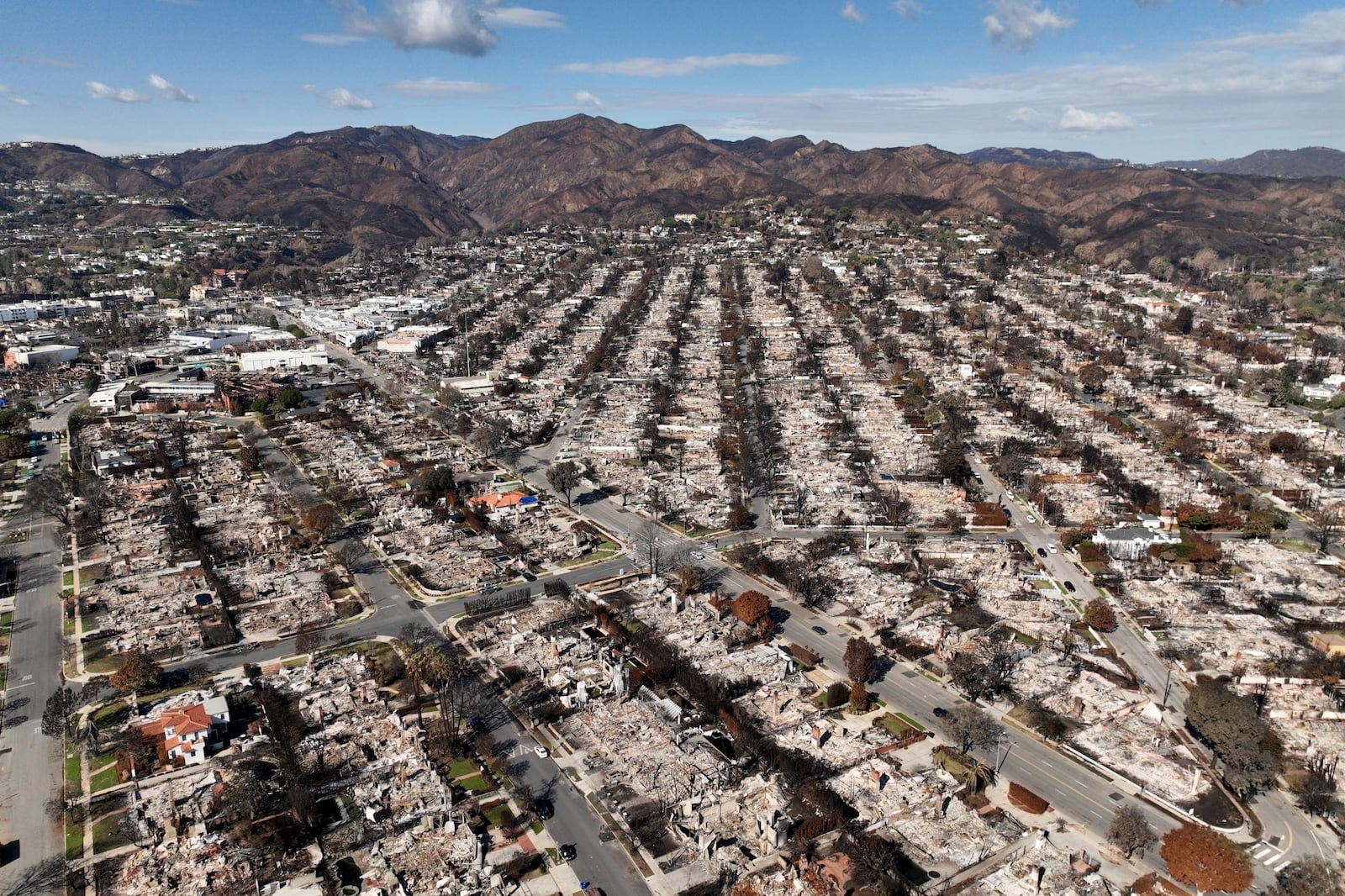 FILE - The devastation from the Palisades Fire is shown in an aerial view in the Pacific Palisades neighborhood of Los Angeles, Monday, Jan. 27, 2025. (AP Photo/Jae C. Hong, File)