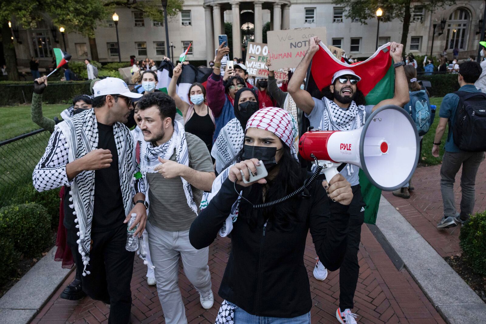 FILE - Mahmoud Khalil, second from left, and Mohsen Mahdawi, left, participate in a pro-Palestinian protest at Columbia University, Thursday, Oct. 12, 2023, in New York. (AP Photo/Yuki Iwamura, File)