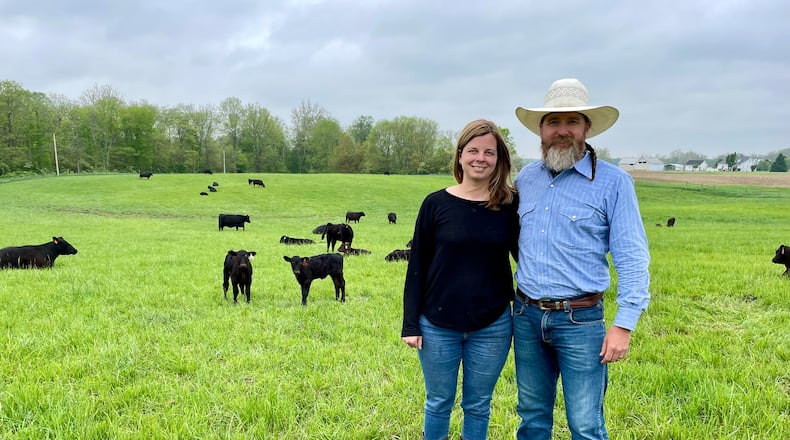 Honey Creek Beef is a closed herd cattle farm located at 6350 Addison-New Carlisle Road, just outside of Champaign County in New Carlisle. Pictured are owners Adam Frantz and his wife, Mia Grimes. NATALIE JONES/STAFF