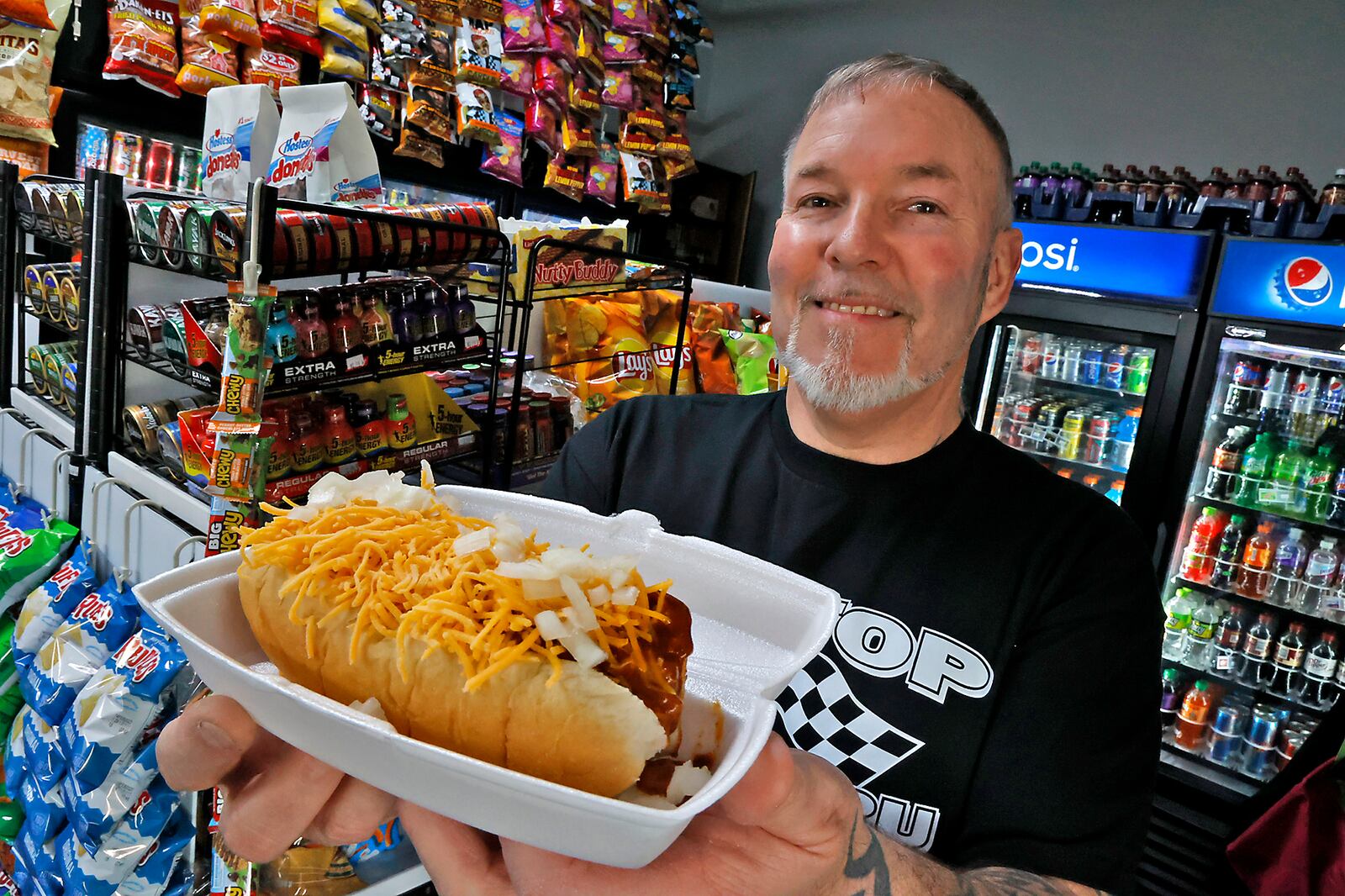 Shane and Tracy Shirk along with their son, Shane Jr., are excited to open Pit Stop Pizza & Subs on April 1, 2023. The restaurant, located on Columbus Avenue in Springfield, has featured a drive thru window since last summer where you can buy convenience store items along with coney dogs and sloppy joe sandwiches but soon will feature a dinning room and offer pizza and sub sandwiches. BILL LACKEY/STAFF