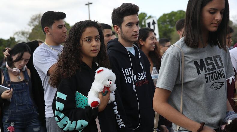 PARKLAND, FL - FEBRUARY 28: Students leave Marjory Stoneman Douglas High School after attending their classes for the first time since the shooting that killed 17 people on February 14 at the school on February 28, 2018 in Parkland, Florida. Police arrested 19-year-old former student Nikolas Cruz for the 17 murders. (Photo by Joe Raedle/Getty Images)
