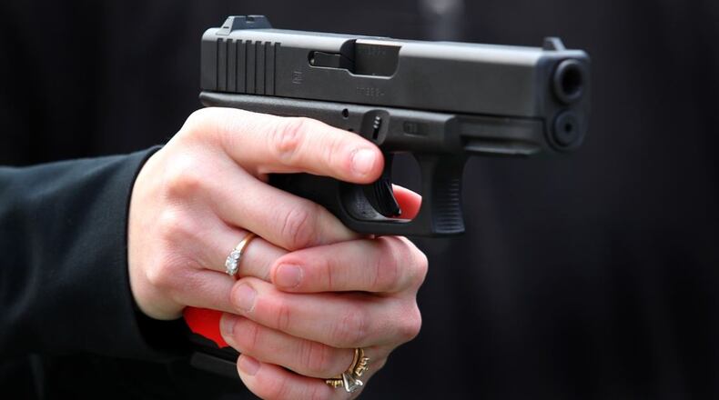 Kroger and Walmart s requests that customers refrain from open carry of guns in their stores raised plenty of discussion among our readers. FILE PHOTO