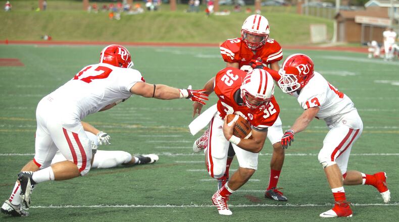 Wittenberg’s Sean Gary scores on a 1-yard run in the fourth quarter against Denison on Saturday, Oct. 12, 2013, at Edwards-Maurer Field in Springfield. David Jablonski/Staff
