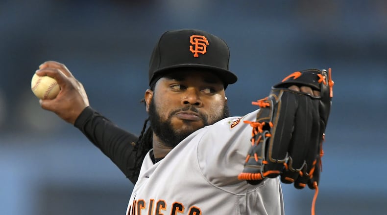 San Francisco Giants starting pitcher Johnny Cueto throws to the plate during the first inning of a baseball game against the Los Angeles Dodgers, Monday, May 1, 2017, in Los Angeles. (AP Photo/Mark J. Terrill)