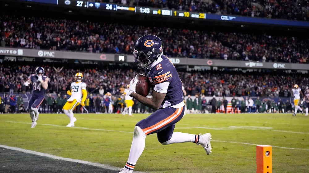 Chicago Bears' DJ Moore catches a touchdown pass during the second half of an NFL wild-card playoff football game against the Green Bay Packers Saturday, Jan. 10, 2026, in Chicago. (AP Photo/Nam Huh)