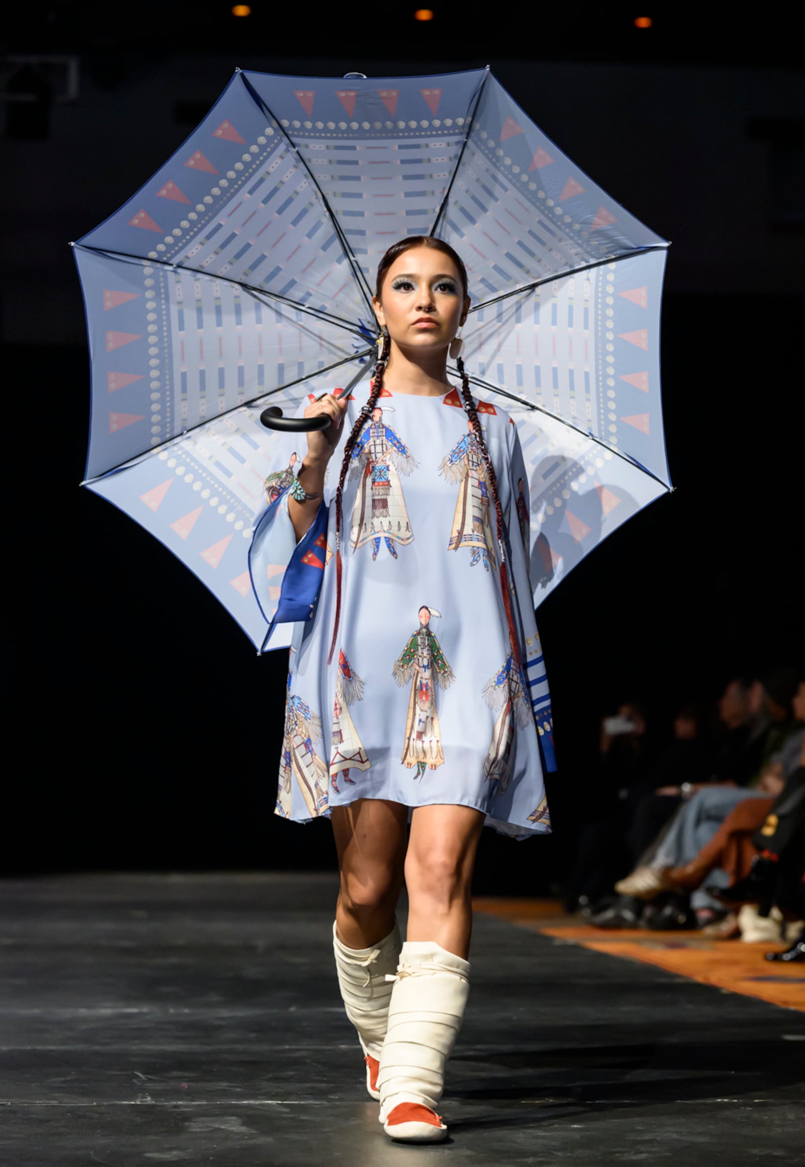 A model wears a design by Lauren Good Day on the runway at the 2025 Native Fashion Show, Friday, May 9, 2025, in Santa Fe, N.M. (AP Photo/Roberto E. Rosales)