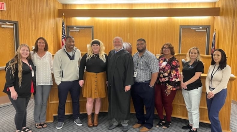 Stephanie Beechler (fourth from left), Clark County Municipal Court's first DRUG Court graduate. Contributed