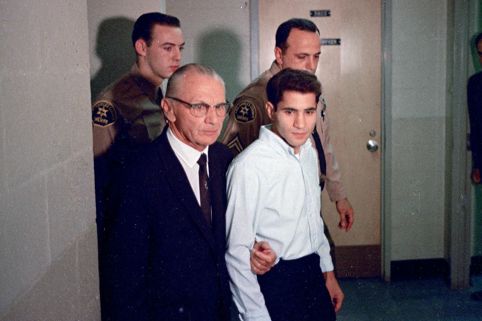 FILE - Sirhan Sirhan, right, accused of assassinating Sen. Robert F. Kennedy, is seen with his attorney Russell E. Parsons in Los Angeles in June 1968. (AP Photo, File)