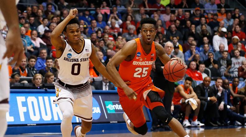 DAYTON, OH - MARCH 14: Tyus Battle #25 of the Syracuse Orange dribbles the ball against Tra Holder #0 of the Arizona State Sun Devils in the first half during the First Four of the 2018 NCAA Men’s Basketball Tournament at UD Arena on March 14, 2018 in Dayton, Ohio. (Photo by Kirk Irwin/Getty Images)