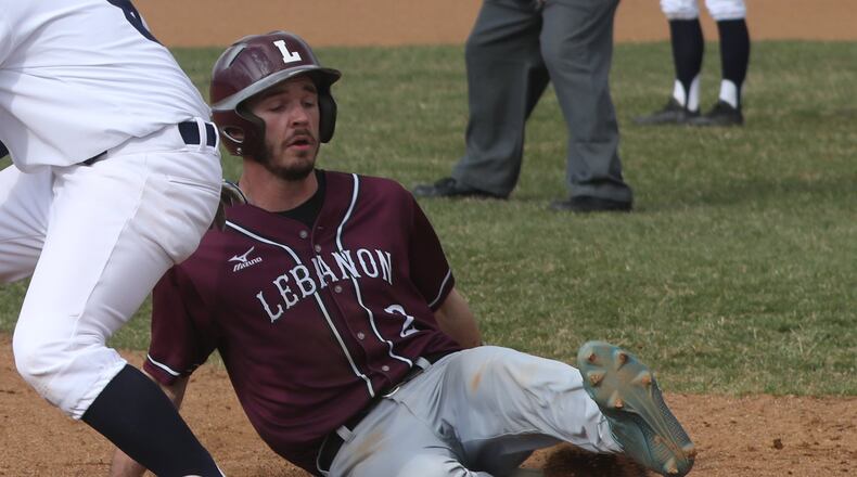 Lebanon’s Austin Harrison slides safely during a game at Springfield. BILL LACKEY/STAFF