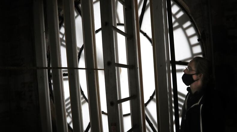 Kasey Eichensehr, senior curator at the Clark County Heritage Center Museum, inside the Heritage Center clock tower Thursday. It's Kasey's job to climb up the inside of the tower and change the time twice a year for Daylight Savings. BILL LACKEY/STAFF