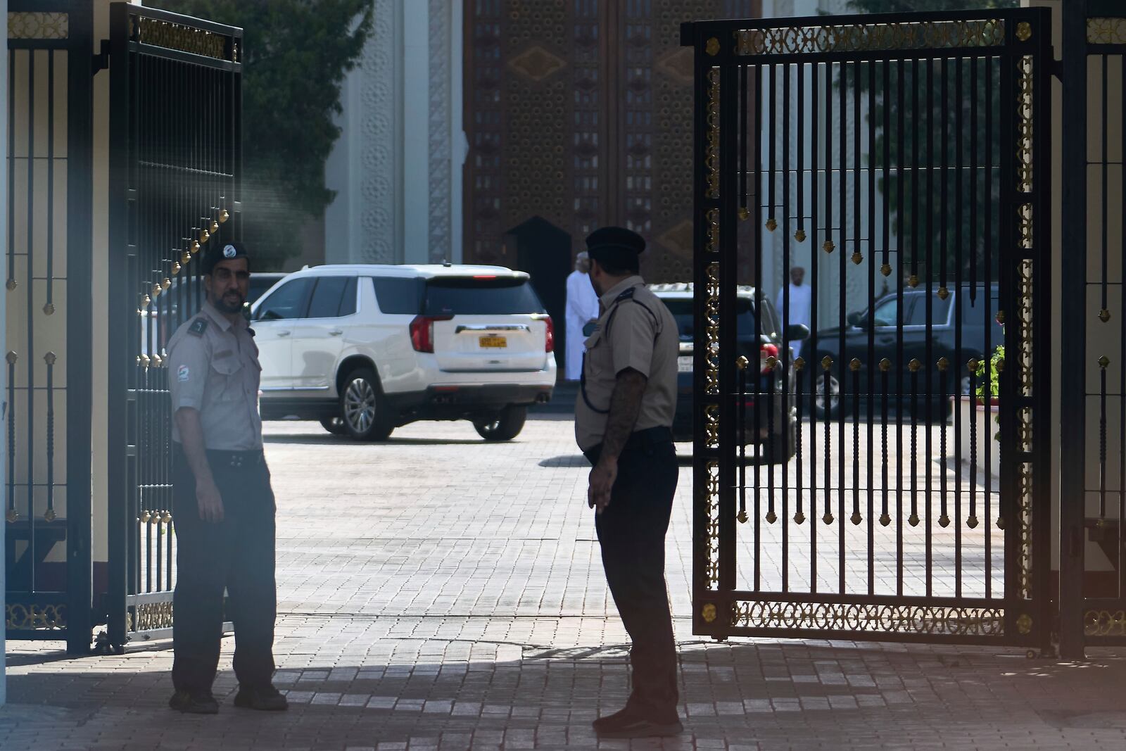 Omani security personnel watch a convoy believed to be carrying U.S. Mideast envoy Steve Witkoff in Muscat, Oman, Saturday, April 12, 2025. (AP Photo/Fatima Shbair)