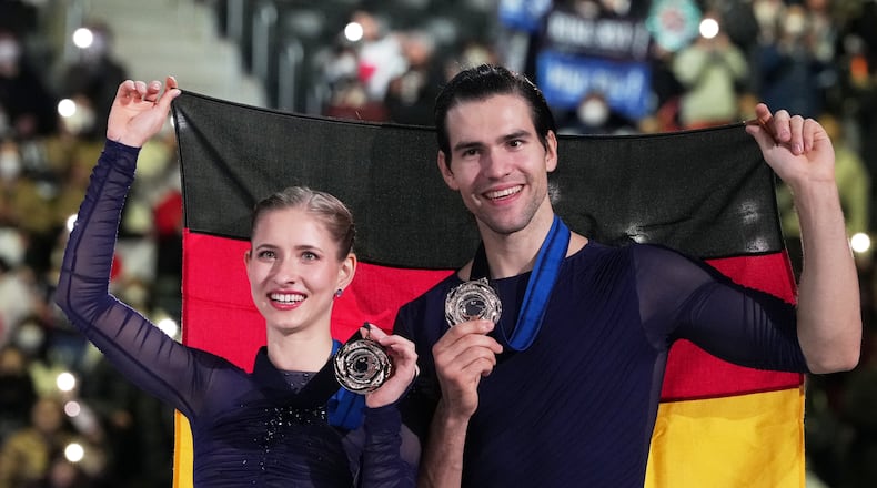 Minerva Fabienne Hase and Nikita Volodin, of Germany, after winning the bronze medal in the pairs competition at the ISU Grand Prix of Figure Skating Final in Nagoya, central Japan, Friday, Dec. 5, 2025. (AP Photo/Hiro Komae)