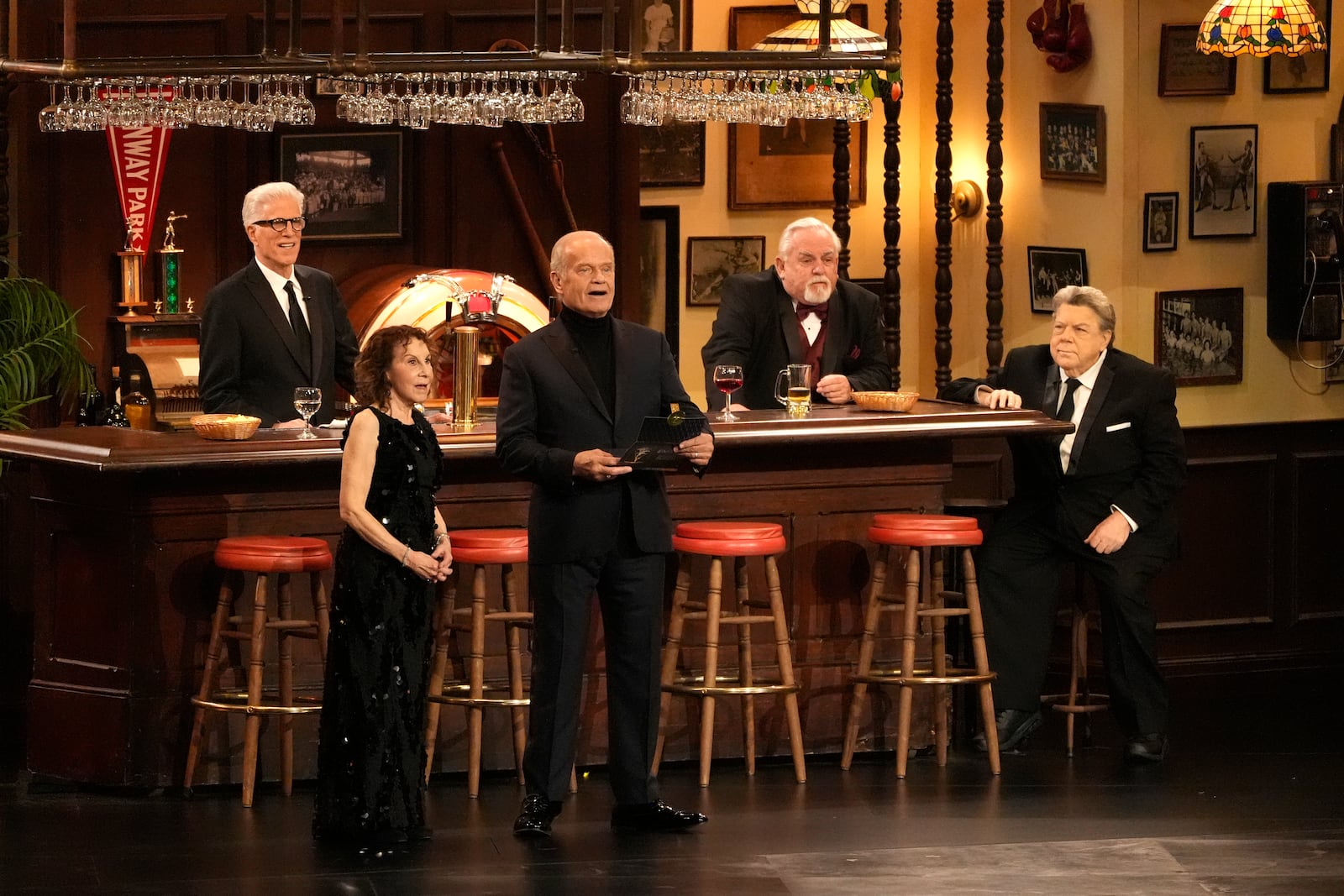 FILE - Rhea Perlman, from left, Kelsey Grammar, Ted Danson, John Ratzenberger, George Wendt present the award for outstanding writing for a comedy series during the 75th Primetime Emmy Awards on Monday, Jan. 15, 2024, at the Peacock Theater in Los Angeles. (AP Photo/Chris Pizzello, file)