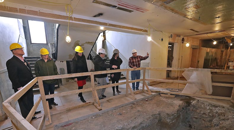 Clark County officials toured the A.B. Graham Building in February. The historic building, which housed several county government offices, was undergoing a massive interior renovation at the time. Renovations are slated to be completed this month. BILL LACKEY/STAFF