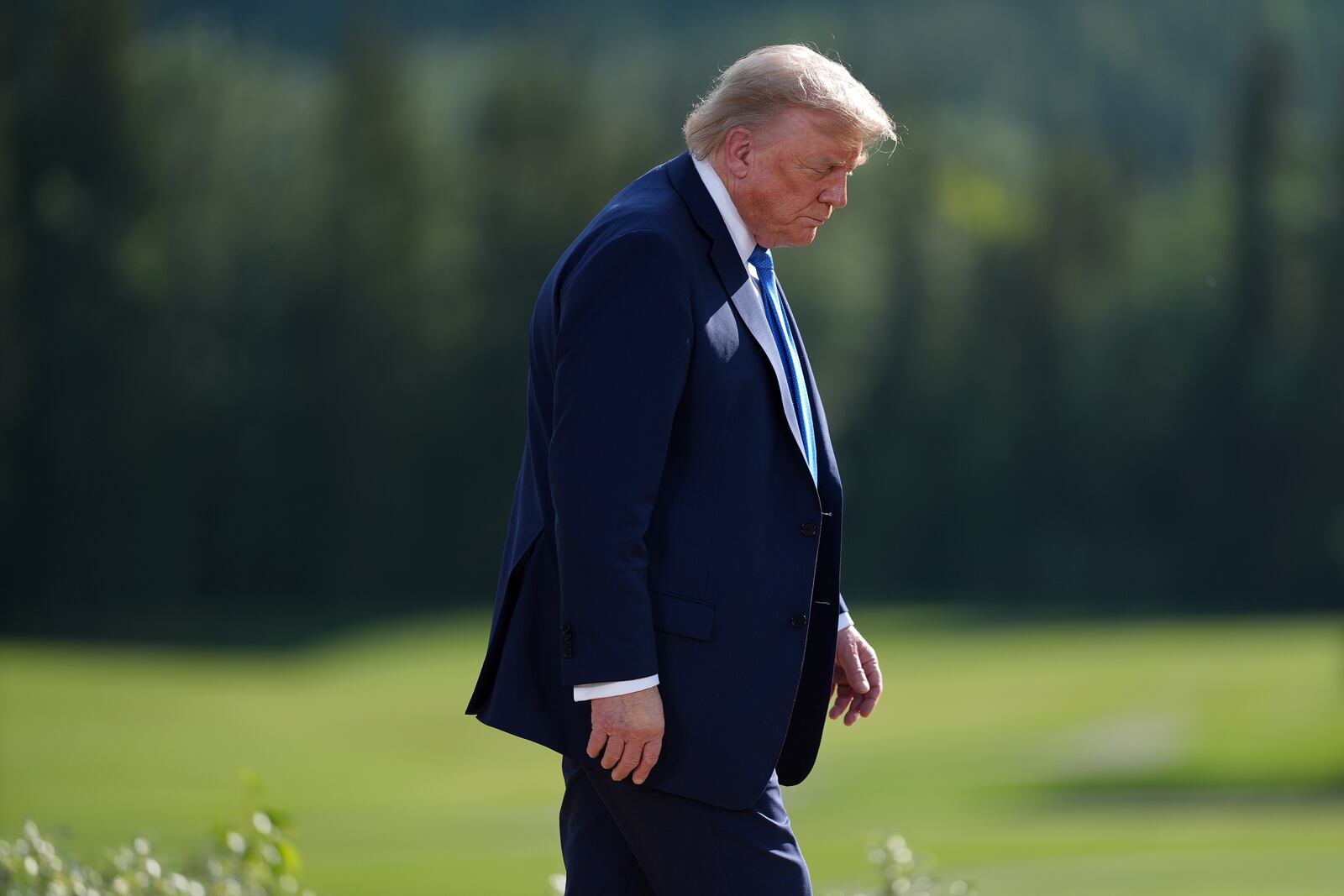 President Donald Trump walks away following the family photograph during the G7 Summit in Kananaskis, Alberta, Monday, June 16, 2025. (Darryl Dyck/The Canadian Press via AP)