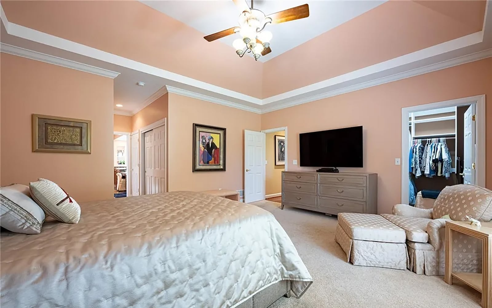 The primary bedroom suite has carpeting, a tray ceiling, ceiling fan and a walk-in closet and ensuite bathroom. CONTRIBUTED